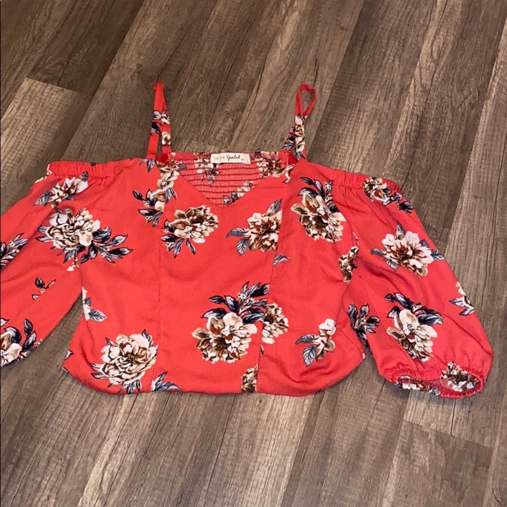 a red floral blouse